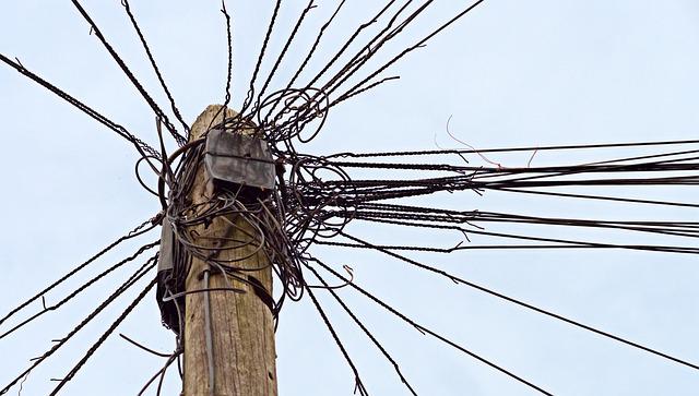 A tangle of wires on a telegraph pole 